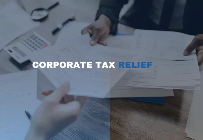 A person handing over papers to another person in background with text overlay "CORPORATE TAX RELIEF"